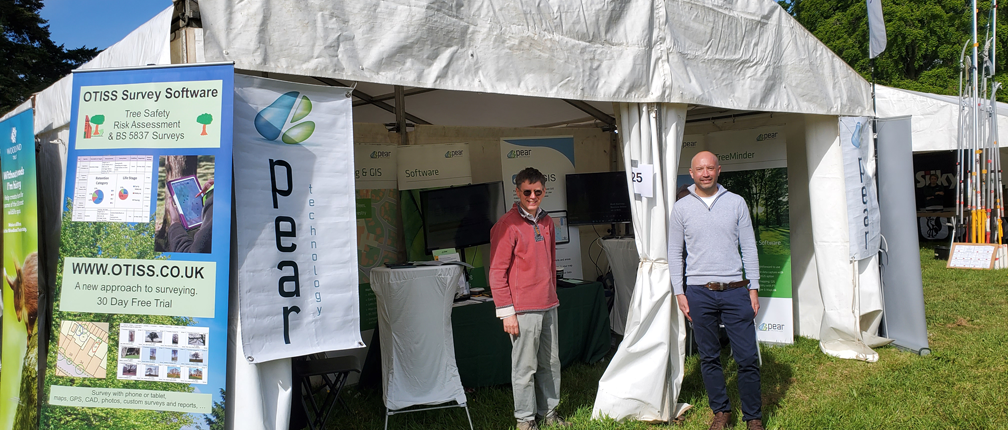Paul and Mark man the Pear and OTISS Arb Show stand on a sunny day